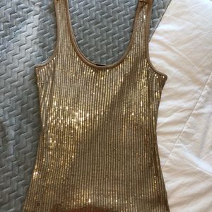 Sequined gold tank top.
